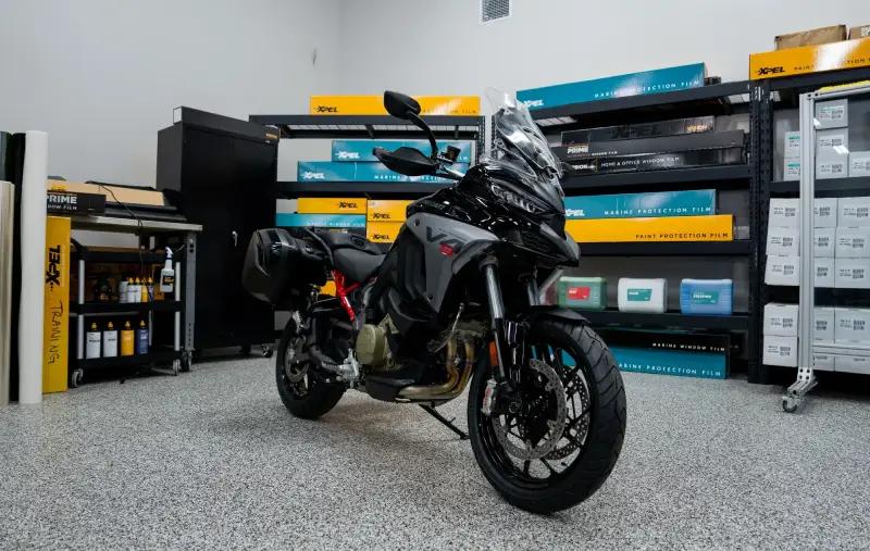 Motorcycle receiving paint protection film on fairings and ceramic coating at Paint Defender in Montgomery, AL.
