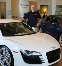 Ken Stommel, founder of Paint Defender and veteran, standing next to a ceramic coated Audi R8 in Montgomery, AL